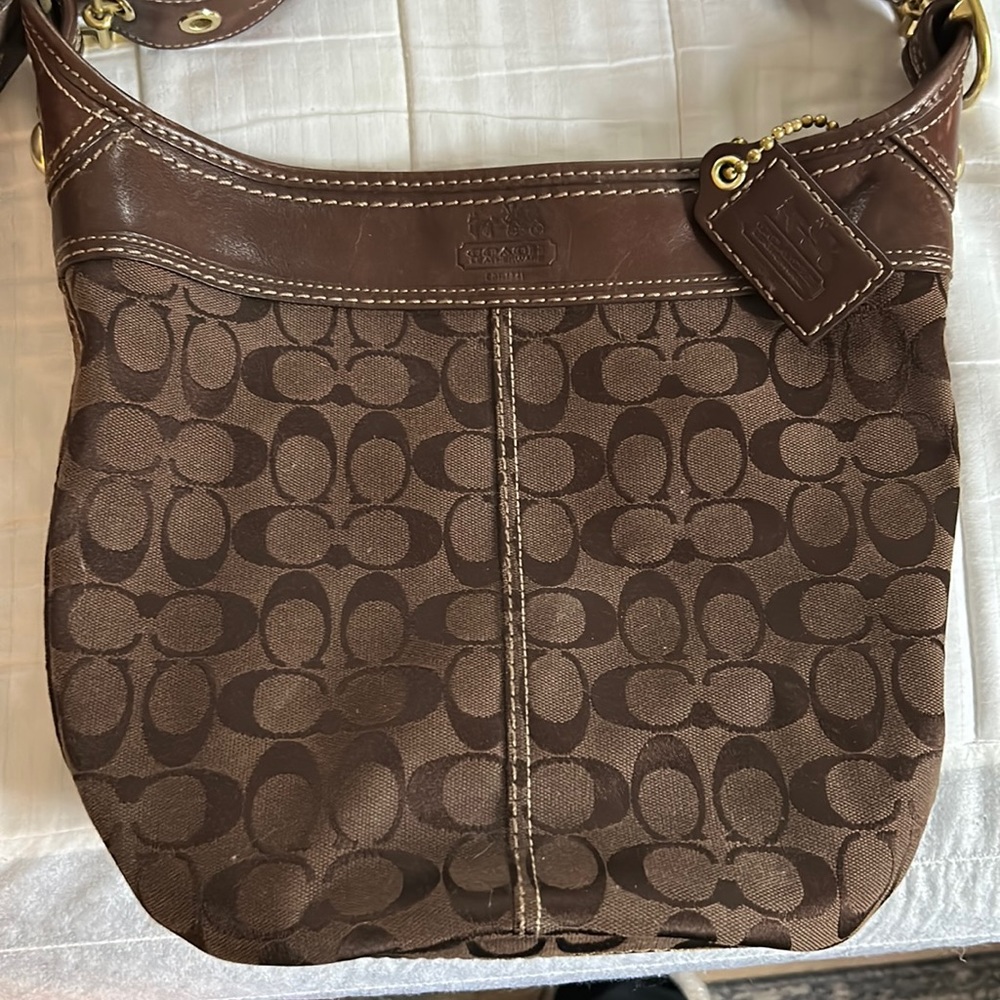 Coach bag…measurements in photos…great condition…three inside pockets…zip top
